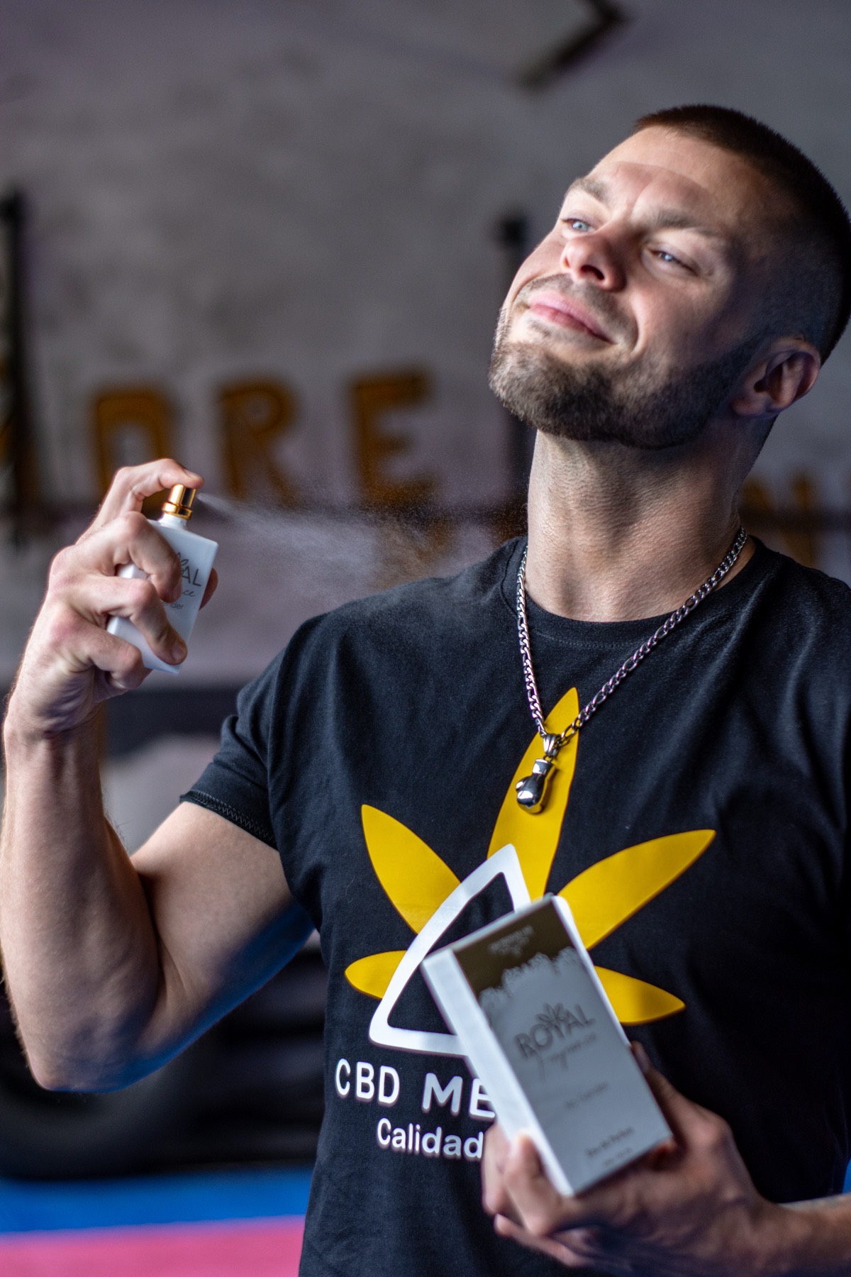 Man using perfume in real photo